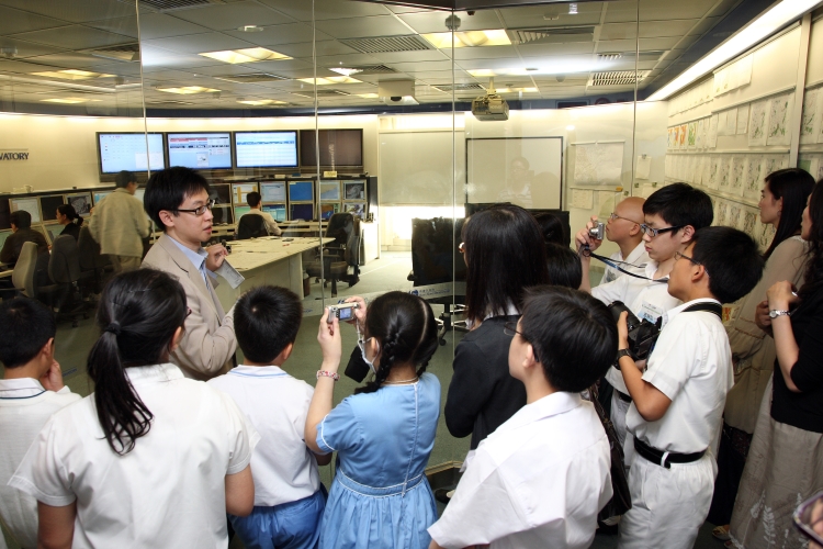 Mr Y F Tong explaining the work of a weather forecaster